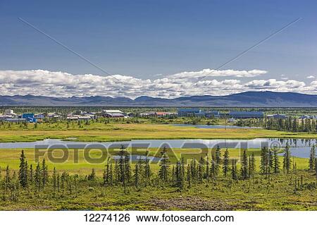 Scenic view of the village of Noatak and the surrounding wetlands, tundra, and Baird Mountains in the distance, Arctic Alaska, Summer View Large Photo Image Stock Photograph - Scenic view of the village of Noatak and the surrounding wetlands, tundra, and Baird Mountains in the distance, Arctic Alaska, Summer. Fotosearch