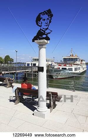 Stock Photo - Sculpture of a man's bust on a column at the waterfront; Am Chiemsee, Bayern, Germany. Fotosearch