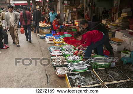 Seafood shops and people around in Bashi Market; Xiamen, Fujian Province, China View Large Photo Image Stock Photo - Seafood shops and people around in Bashi Market; Xiamen, Fujian Province, China. Fotosearch