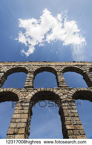 Stock Photograph - Segovia's Aqueduct is one of the architectural symbols of Spain, built in the 2nd Century A. D; Segovia city, Castilla Leon, Spain. Fotosearch