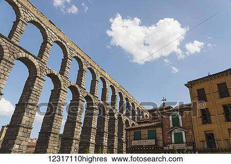 Stock Photograph - Segovia's Aqueduct, one of the architectural symbols of Spain, built in the 2nd Century A. D; Segovia city, Castilla Leon, Spain. Fotosearch