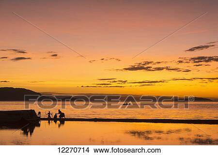 Silhouette of people on beach at Cape Maclear, Lake Malawi; Malawi View Large Photo Image Picture - Silhouette of people on beach at Cape Maclear, Lake Malawi; Malawi. Fotosearch