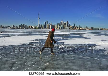 Skater and city skyline from Ward's Island; Toronto, Ontario, Canada View Large Photo Image Stock Photography - Skater and city skyline from Ward's Island; Toronto, Ontario, Canada. Fotosearch