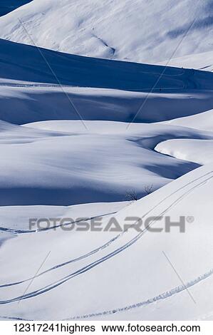 Stock Photograph - Ski tracks in Hatcher Pass, an important and popular ski area as it normally receives a lot of snow, South-central Alaska; Alaska, United States of America. Fotosearch