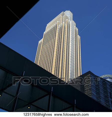 Skyscraper against a blue sky; Minneapolis, Minnesota, United States of America View Large Photo Image Stock Photograph - Skyscraper against a blue sky; Minneapolis, Minnesota, United States of America. Fotosearch