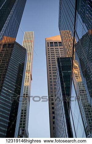Skyscrapers with glass facade reflecting other buildings, and 432 Park Avenue, the tallest residential building; New York City, New York, United States of America View Large Photo Image Stock Photograph - Skyscrapers with glass facade reflecting other buildings, and 432 Park Avenue, the tallest residential building; New York City, New York, United States of America. Fotosearch