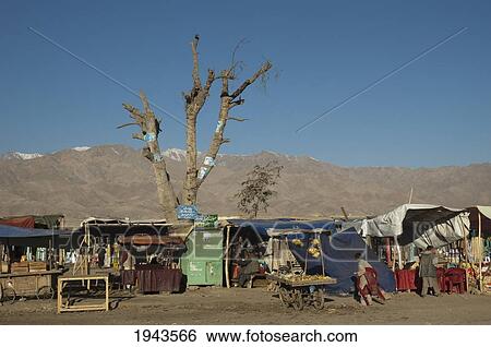 Stock Photograph - Small Bazaar Along The Kabul To Charikar Road, Parwan Province, Afghanistan. Fotosearch