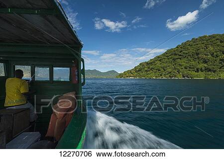 Small boat going past island off Cape Maclear, Lake Malawi; Malawi View Large Photo Image Stock Photograph - Small boat going past island off Cape Maclear, Lake Malawi; Malawi. Fotosearch