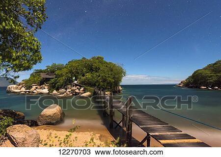Small bridge going from Mumbo Island to small island for tourist's accommodation under a starry sky, Lake Malawi; Malawi View Large Photo Image Stock Image - Small bridge going from Mumbo Island to small island for tourist's accommodation under a starry sky, Lake Malawi; Malawi. Fotosearch