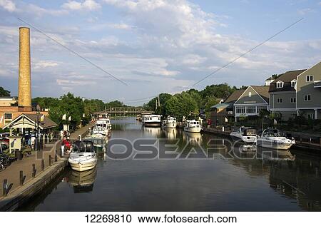 Small private and charter boats tied up along canal wall, looking East; Fairport, New York, United States of America View Large Photo Image Stock Image - Small private and charter boats tied up along canal wall, looking East; Fairport, New York, United States of America. Fotosearch