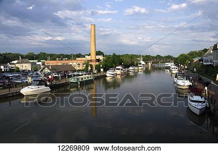 Stock Photo - Small private and charter boats tied up along canal wall, looking East; Fairport, New York, United States of America. Fotosearch