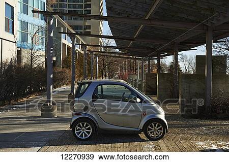 Stock Photo - Smart Car parked at harbourfront in winter; Toronto, Ontario, Canada. Fotosearch