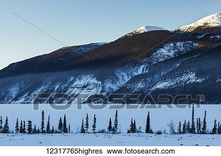 Stock Photograph - Snow covered landscape in the Rocky Mountains; British Columbia, Canada. Fotosearch