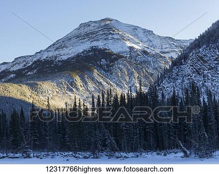 Stock Photograph - Snow covered landscape in the Rocky Mountains; British Columbia, Canada. Fotosearch