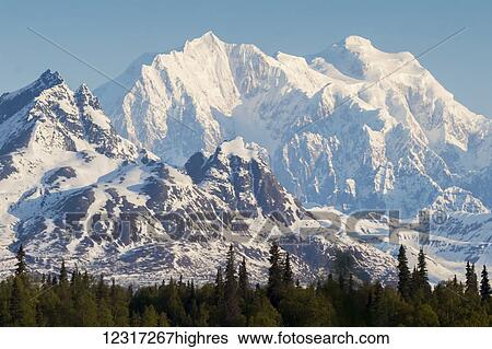 Stock Photograph - Snow covered mountains of the Alaska Range, photographed from Denali Viewpoint South overlook area, Parks Highway; Alaska, United States of America. Fotosearch