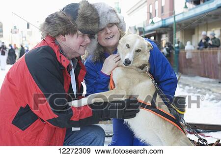 Spectators meet the dogs before the start of the 2011 Iditarod Race in downtown Anchorage, Alaska View Large Photo Image Stock Photo - Spectators meet the dogs before the start of the 2011 Iditarod Race in downtown Anchorage, Alaska. Fotosearch