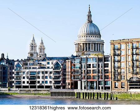 Stock Photograph - St Paul's Cathedral and riverside buildings; London, England. Fotosearch