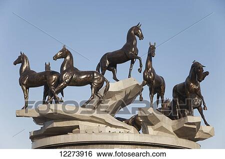 Stock Photograph - Statue of Akhal-Tekke horses; Ashgabat, Turkmenistan. Fotosearch