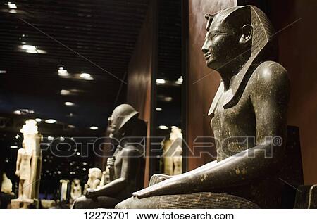 Stock Image - Statues in the Egyptian Museum; Turin, Piedmont, Italy. Fotosearch