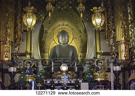 Stone buddha against gold background in a Japanese temple; Uji, Kyoto, Japan View Large Photo Image Stock Photo - Stone buddha against gold background in a Japanese temple; Uji, Kyoto, Japan. Fotosearch