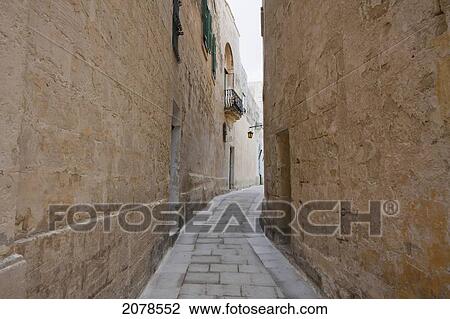 Stock Image - Stone Houses On A Narrow Street, Mdina, Malta. Fotosearch
