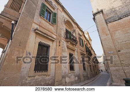 Stone Houses On A Narrow Street, Mdina, Malta View Large Photo Image Stock Image - Stone Houses On A Narrow Street, Mdina, Malta. Fotosearch