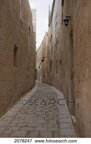 Stone Houses On A Narrow Street, Mdina, Malta View Large Photo Image Stock Photo - Stone Houses On A Narrow Street, Mdina, Malta. Fotosearch