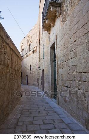 Stone Houses On A Narrow Street, Mdina, Malta View Large Photo Image Stock Photo - Stone Houses On A Narrow Street, Mdina, Malta. Fotosearch