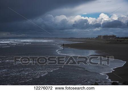 Storm clouds loom over the beach; Seaside, Oregon, United States of America View Large Photo Image Stock Image - Storm clouds loom over the beach; Seaside, Oregon, United States of America. Fotosearch