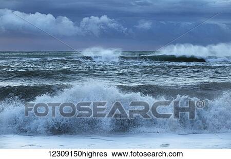 Stormy skies over a west coast beach; Greymouth, South Island, New Zealand View Large Photo Image Stock Photograph - Stormy skies over a west coast beach; Greymouth, South Island, New Zealand. Fotosearch