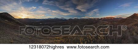 Stock Photograph - Sunrise in Denali National Park seen from Polychrome Pass overlook; Alaska, United States of America. Fotosearch