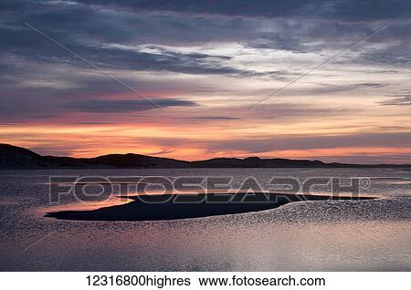 Stock Photograph - Sunrise over the ocean; Sable Island, Nova Scotia, Canada. Fotosearch