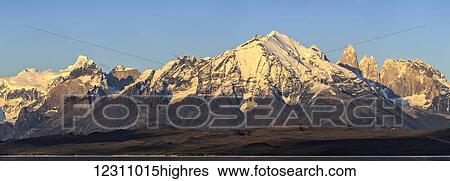 Sunrise panorama of Cordillera Paine Range in Torres del Paine National Park with Lake Sarmiento and famous Torres del Paine peaks in Chilean part of Patagonia; Chile View Large Photo Image Stock Photograph - Sunrise panorama of Cordillera Paine Range in Torres del Paine National Park with Lake Sarmiento and famous Torres del Paine peaks in Chilean part of Patagonia; Chile. Fotosearch