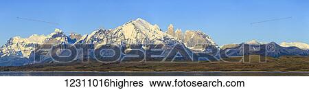 Sunrise panorama of Cordillera Paine Range in Torres del Paine National Park with Lake Sarmiento and famous Torres del Paine peaks in Chilean part of Patagonia; Chile View Large Photo Image Stock Photograph - Sunrise panorama of Cordillera Paine Range in Torres del Paine National Park with Lake Sarmiento and famous Torres del Paine peaks in Chilean part of Patagonia; Chile. Fotosearch