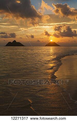 Sunset at Lanikai Beach, with Mokuluas islands in the background; Oahu, Hawaii, United States of America View Large Photo Image Stock Photo - Sunset at Lanikai Beach, with Mokuluas islands in the background; Oahu, Hawaii, United States of America. Fotosearch