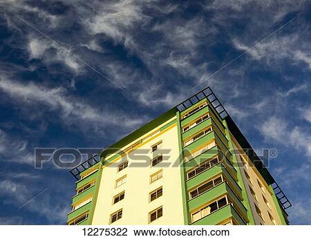 Stock Image - Sunset on a colorful apartment building; Vancouver, British Columbia, Canada. Fotosearch