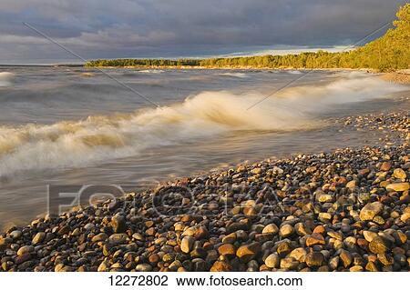 Stock Image - Surf during a windy evening at Hillside Beach on Lake Winnipeg; Manitoba, Canada. Fotosearch