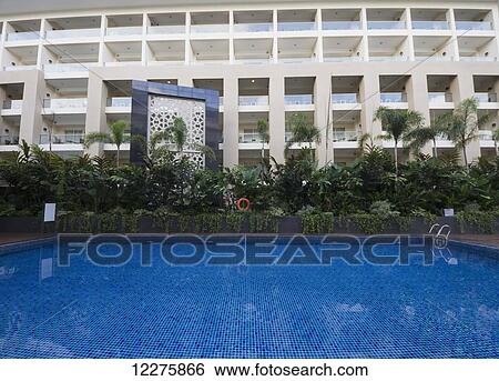 Swimming pool of the Eastparc Hotel, Yogyakarta, Java Island, Indonesia View Large Photo Image Stock Photograph - Swimming pool of the Eastparc Hotel, Yogyakarta, Java Island, Indonesia. Fotosearch
