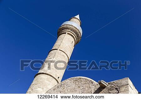 Picture - Tall stone tower against a blue sky; Nicosia, Cyprus. Fotosearch