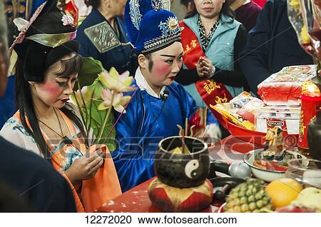 Stock Image - Taoist ritual inside of temple made by Chinese Opera actors; Xiamen, Fujian, China. Fotosearch