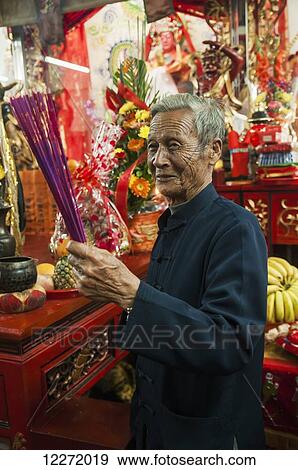 Stock Photo - Taoist ritual inside of temple made by Chinese Opera actors; Xiamen, Fujian, China. Fotosearch