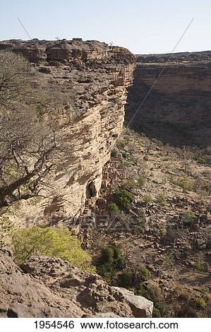 Stock Photograph - Telem houses on the Bandiagara Escarpment, Bongo, Mali. Fotosearch
