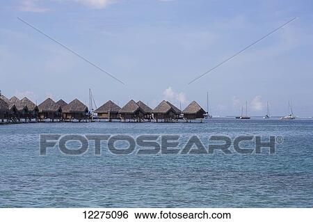 Thatched guest rooms elevated in the water; Tahiti View Large Photo Image Stock Photograph - Thatched guest rooms elevated in the water; Tahiti. Fotosearch
