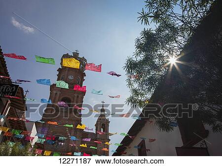 The Church of Our Lady of Guadalupe during the feast of the Virgin of Guadalupe; Puerto Vallerta, Mexico View Large Photo Image Stock Photo - The Church of Our Lady of Guadalupe during the feast of the Virgin of Guadalupe; Puerto Vallerta, Mexico. Fotosearch