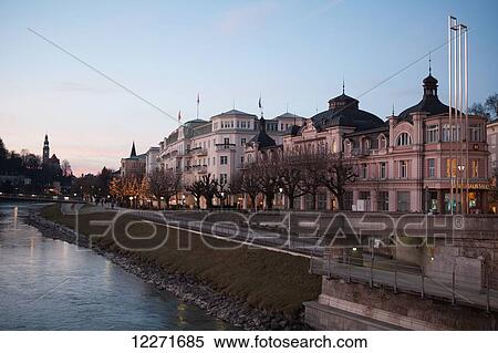 Stock Photography - The historic centre seen from the Salzach river at dusk; Salzburg, Austria. Fotosearch