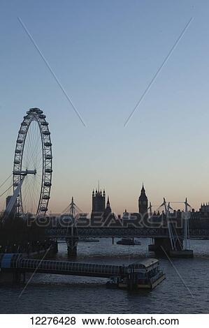 The River Thames in Central London with the London Eye, Houses of Parliament, Big Ben and South Bank, including the Royal Festival Hall and Hayward Gallery; London, England View Large Photo Image Stock Photo - The River Thames in Central London with the London Eye, Houses of Parliament, Big Ben and South Bank, including the Royal Festival Hall and Hayward Gallery; London, England. Fotosearch