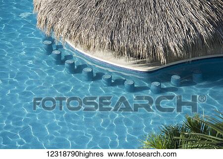 The swim up bar at the Emporio hotel; Ixtapa, Mexico View Large Photo Image Stock Photograph - The swim up bar at the Emporio hotel; Ixtapa, Mexico. Fotosearch