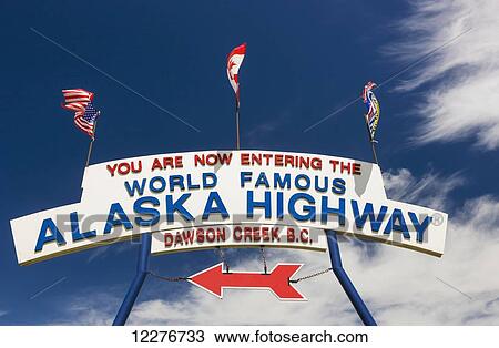 Stock Image - The World Famous Alaska Highway sign, Dawson Creek, British Columbia, Canada, Summer . Fotosearch