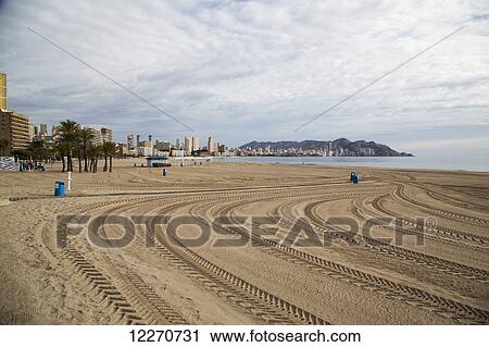 Stock Image - Tire tracks on the beach along the mediterranean; Benidorm, Spain. Fotosearch