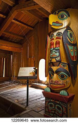 Tlingit clan house and totem pole at the Haida and Tsimshian Village Site at Alaska Native Heritage Center, Anchorage, Southcentral Alaska, Summer. View Large Photo Image Stock Photography - Tlingit clan house and totem pole at the Haida and Tsimshian Village Site at Alaska Native Heritage Center, Anchorage, Southcentral Alaska, Summer.. Fotosearch